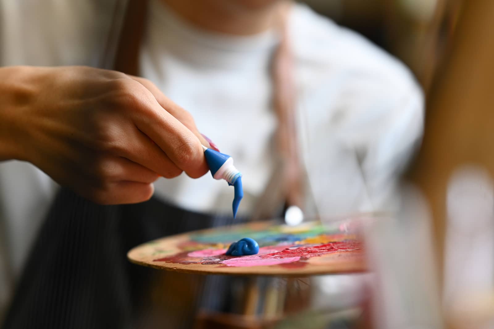 Cropped Image Of Male Artist Holding Painting Brush And Mixing C